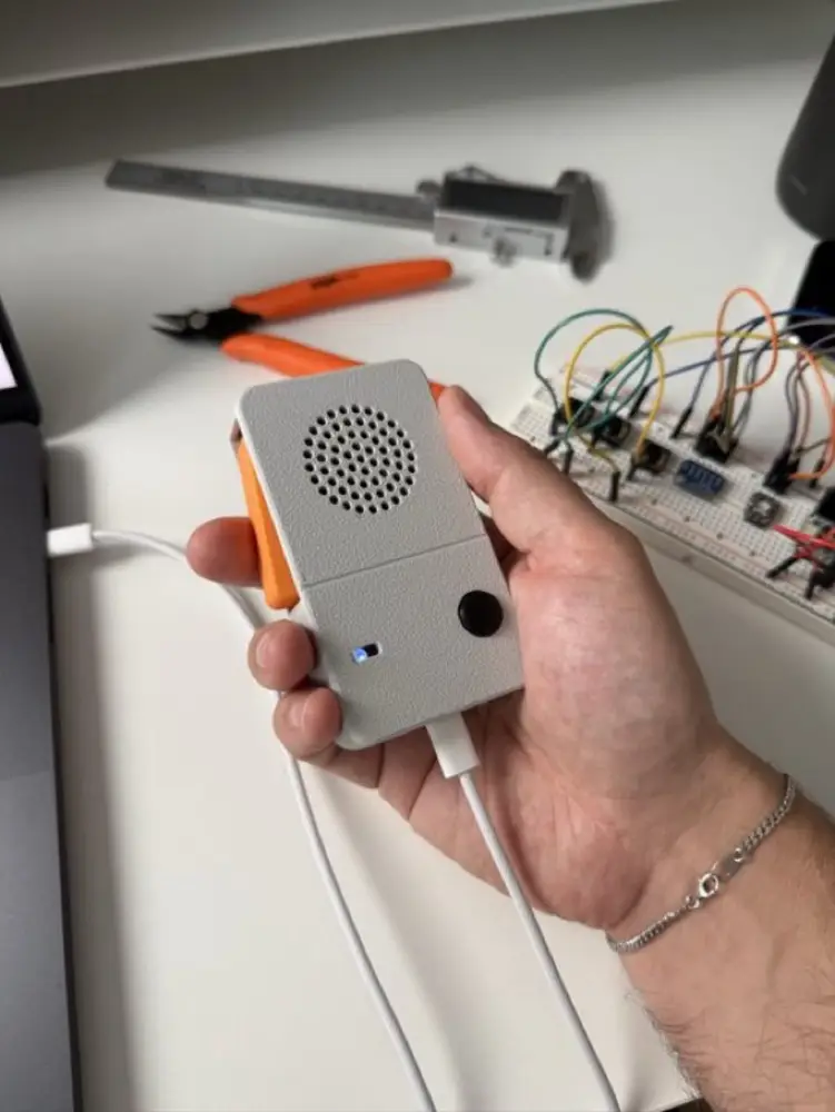 The inspiration: a handheld recorder-style gadget with a big side trigger. Our version keeps the trigger and the handheld shape, but throws away the recorder - it is purely a live microphone for the computer. Photos you supplied.